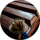 A family member standing beside the coffins of his relatives
