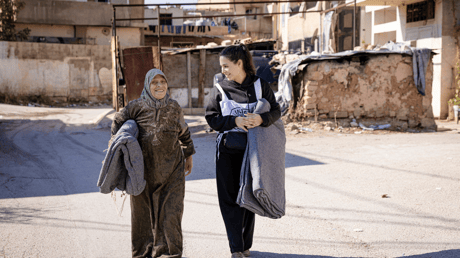 ICRC Staff talking to a lady