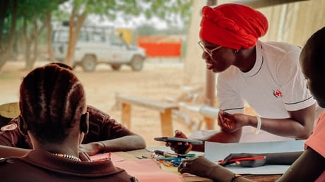 A kenya red cross staff member conducting risk mapping